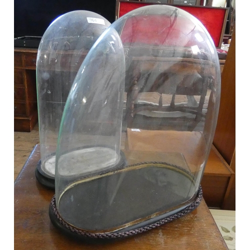 133 - Two Victorian glass taxidermy or clock domes, largest dome measures 40cms high including base X 12 1... 