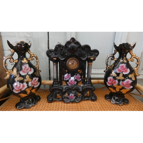 135 - An Edwardian china clock garniture