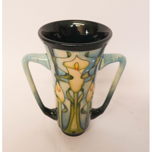 164 - A modern Moorcroft twin handled vase, decorated with Arum lilies, dated 2001 to the base, 15cms tall