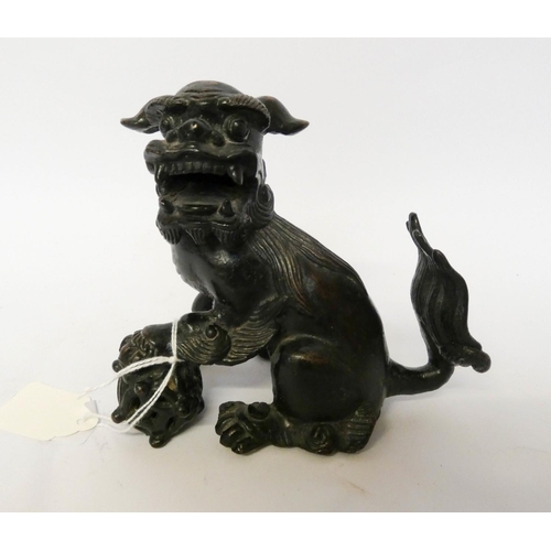 167 - A bronze Japanese temple dog, 12cms tall