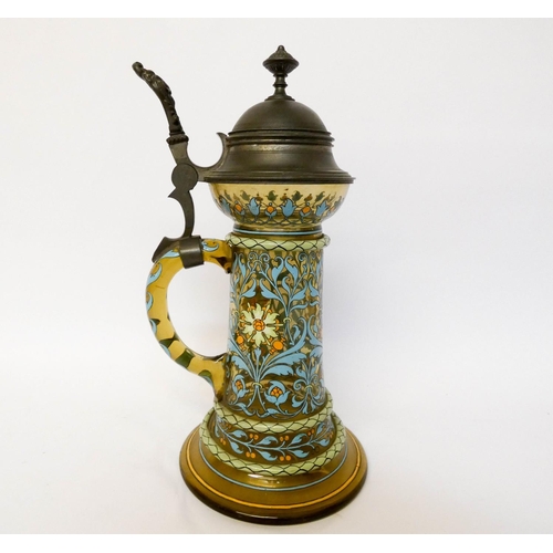 169 - A German enamelled green glass lidded tankard with pewter mounts, standing 27cms tall