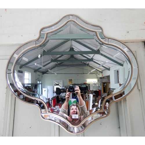 99 - An Art Deco style bevel edged shaped wall mirror