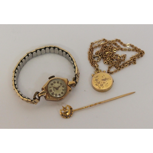 477 - Edwardian circular gold locket on plated chain, gold cased ladies wristwatch and an 18ct gold stickp... 