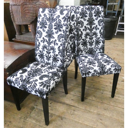 139 - Three modern black and white upholstered high backed dining room chairs