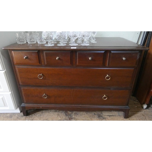 143 - A Stag minstrel low mahogany chest of two long and four small drawers