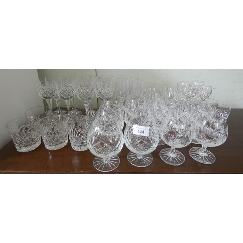 144 - A quantity of matching cut wine glasses, whiskey tumblers etc