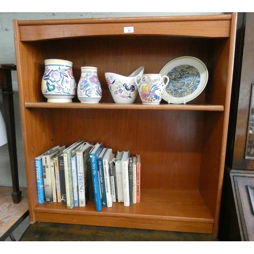 22 - A small teak finished open bookcase