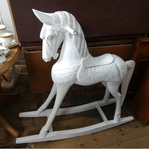 67 - An Indonesian carved white painted rocking horse