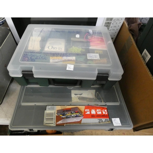 764 - Three assorted fishing tackle boxes with contents, mostly fly fishing, a fishing jacket, accessories... 