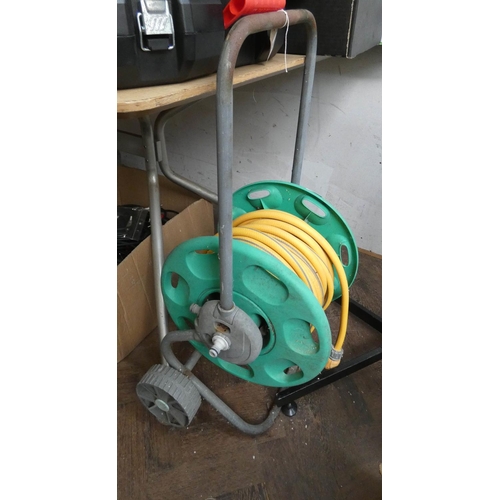 776 - A hose on reel with wheels