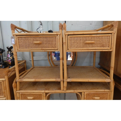 98 - A pair of bamboo and wicker work of bedside cabinets and dressing table with shaped ends