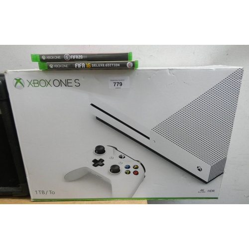 779 - An XBox 1X with controllers, games etc