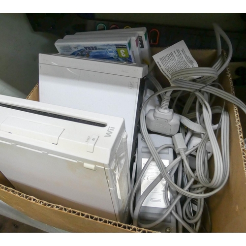 829 - Two Wii consoles with controllers, games and two Guitar Hero guitars (as found)