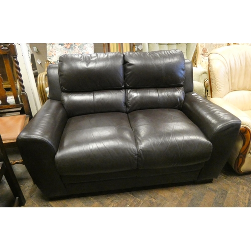 205 - A two seater settee in chocolate brown leather