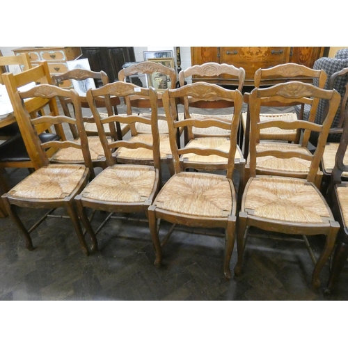 209 - A set of French light wood ladder back dining chairs with rush seats on cabriole style legs