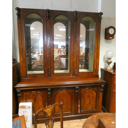 296 - A Victorian mahogany three door glazed bookcase with mirrored interior and glass shelves, standing o... 