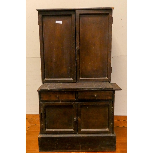 297 - A late Victorian stained child's/dolls dresser, fitted cupboards, shelves and two drawers together w... 