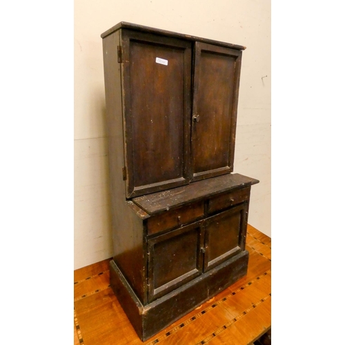 297 - A late Victorian stained child's/dolls dresser, fitted cupboards, shelves and two drawers together w... 