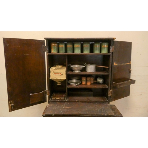 297 - A late Victorian stained child's/dolls dresser, fitted cupboards, shelves and two drawers together w... 