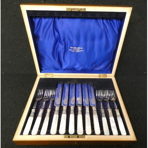 415 - A cased set of six mother of pearl tea knives and forks