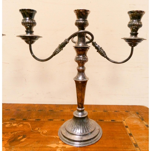 416 - A pair of silver plated three branch candelabra