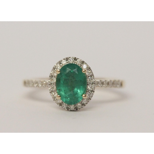 485 - 14ct gold emerald and diamond oval cluster ring, with diamond shoulders, hallmarked , ring size P