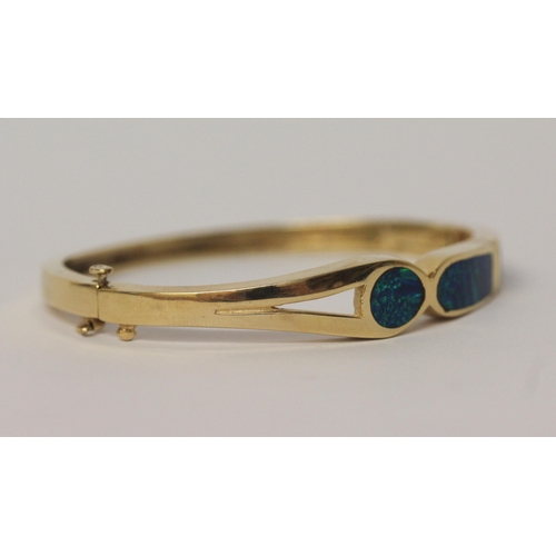 486 - A modern 14k yellow gold opal set hinged bangle, marked 14k,  gross weight 26.7 g