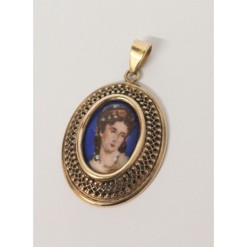 493 - A Limoges porcelain panel locket in filigree yellow metal mount, marked Sharmaine Paris