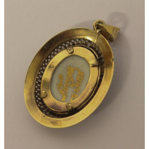 493 - A Limoges porcelain panel locket in filigree yellow metal mount, marked Sharmaine Paris