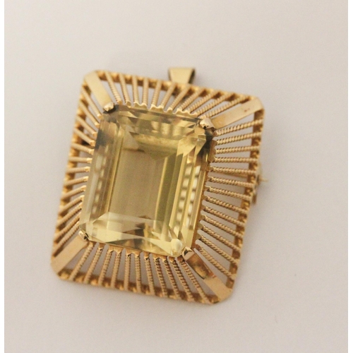 507 - An 18ct gold pendant brooch mounted with a large impressive emerald cut citrine, within rectangular ... 