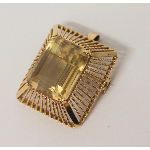 507 - An 18ct gold pendant brooch mounted with a large impressive emerald cut citrine, within rectangular ... 