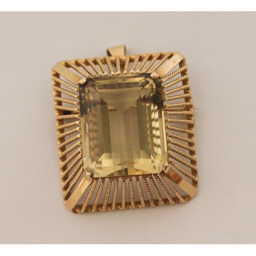 507 - An 18ct gold pendant brooch mounted with a large impressive emerald cut citrine, within rectangular ... 