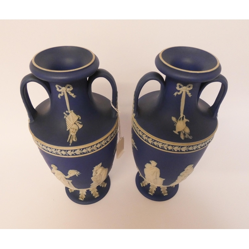 184 - A Pair of Wedgwood Jasper Ware Vases, dipped in deep blue jasper and ornamented with the muses, the ... 