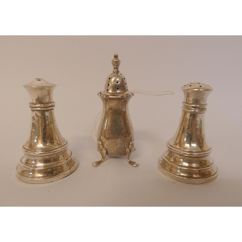 421 - A hallmarked silver salt and pepper pot and a further silver pepper pot