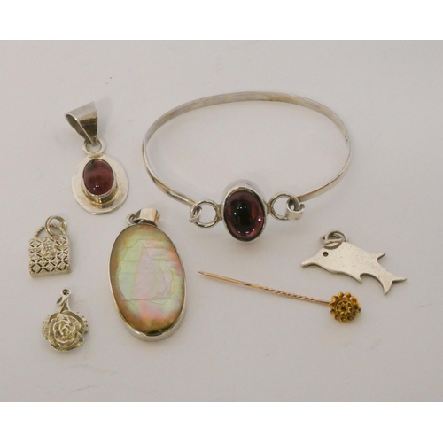 464 - A Victorian gold and rose cut diamond stick pin and three silver pendants together with silver hinge... 