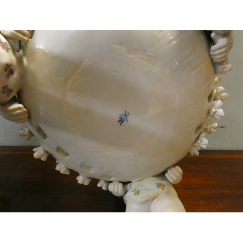 187 - Large pair matching Dresden style pierced centrepiece bowls supported by cherubs, 22cms tall