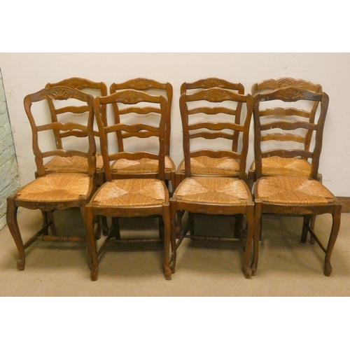 209 - A set of French light wood ladder back dining chairs with rush seats on cabriole style legs