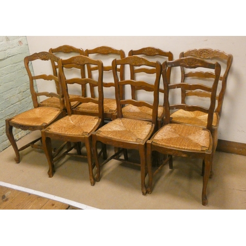 209 - A set of French light wood ladder back dining chairs with rush seats on cabriole style legs