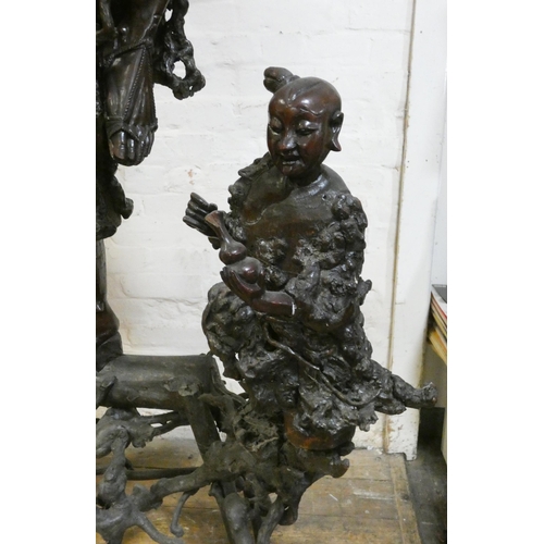 233 - A large Japanese root carving of a man balancing on one leg, , overall height 64 1/2