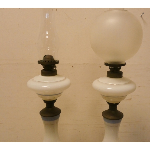 267 - A pair of Victorian Napoleon and Josephine decorated opaline glass oil lamps on brass bases, 30