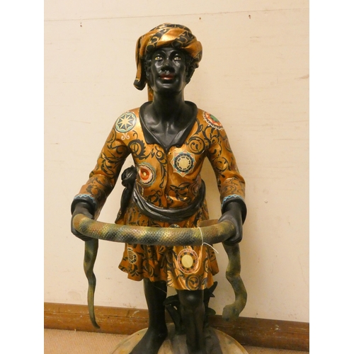 273 - A gilt decorated Blackamoor figure holding a snake umbrella stand, 49