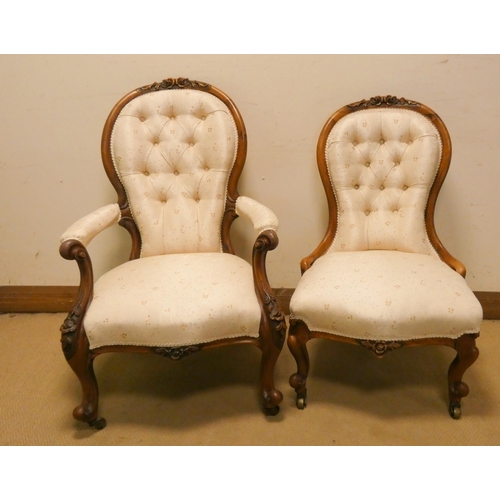 275 - A pair of Victorian walnut ladies and gents chairs with button back cream upholstered seats, standin... 