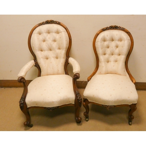 275 - A pair of Victorian walnut ladies and gents chairs with button back cream upholstered seats, standin... 