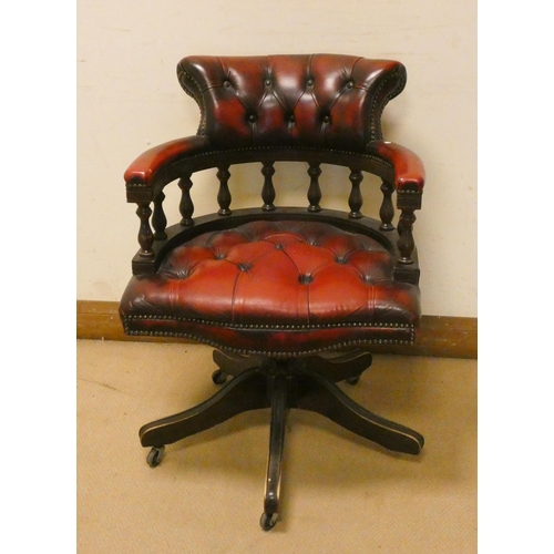 276 - A Captains style revolving mahogany office elbow chair with red buttoned leather upholstered seat an... 