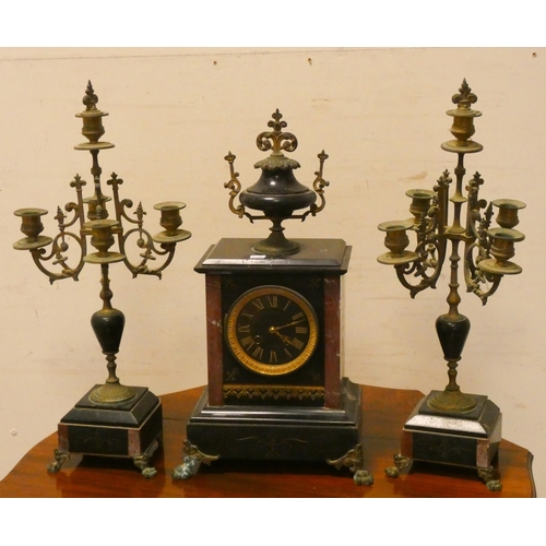 279 - A French black marble three piece clock garniture, comprising striking mantle clock and a pair of br... 