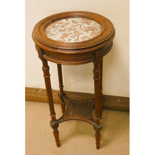 290 - A French two tier walnut plant table with inset marble top and cane under tier, 15