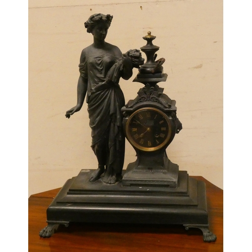 291 - A French figure decorated striking mantle clock on ebonised base with brass feet, 20