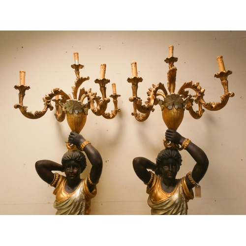 308 - A pair of tall Blackamoor figure candle holders, wired for electricity, each 7'3 tall