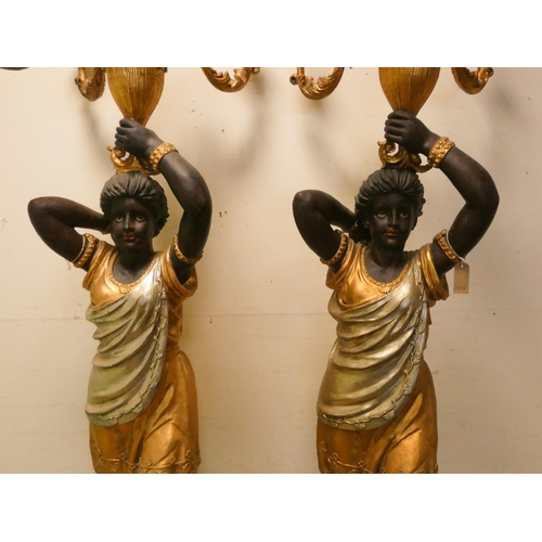 308 - A pair of tall Blackamoor figure candle holders, wired for electricity, each 7'3 tall