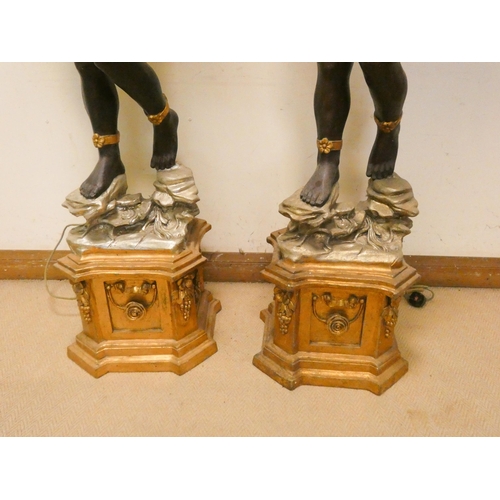 308 - A pair of tall Blackamoor figure candle holders, wired for electricity, each 7'3 tall